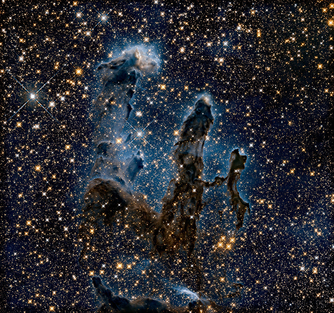 Innrauð mynd af Stólpum sköpunarinnar í Arnarþokunni (Messier 16). Mynd: NASA/ESA og Hubble