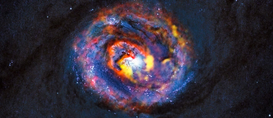 Samsett mynd af vetrarbrautinni NGC 1433 frá ALMA og Hubble